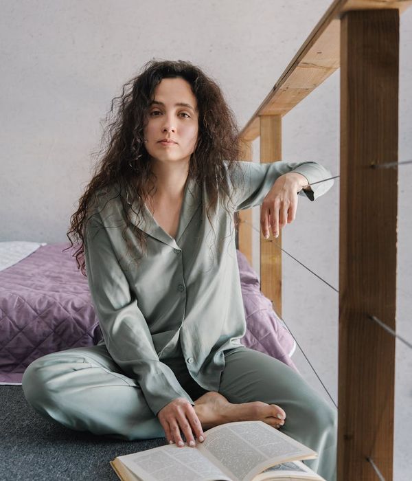 Woman feeling energized and happy after a light home workout.